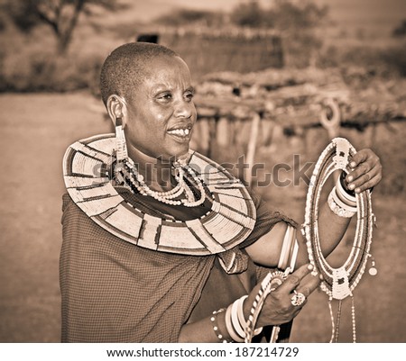 TANZANIA, AFRICA-FEBRUARY 9, 2014: Masai woman with traditional  ornaments, review of daily life of local people on February 9, 2014. Tanzania.