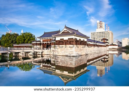 Entrance at Hiroshima castle with wall and water pond to protect from the enemy. Hiroshima, Japan.