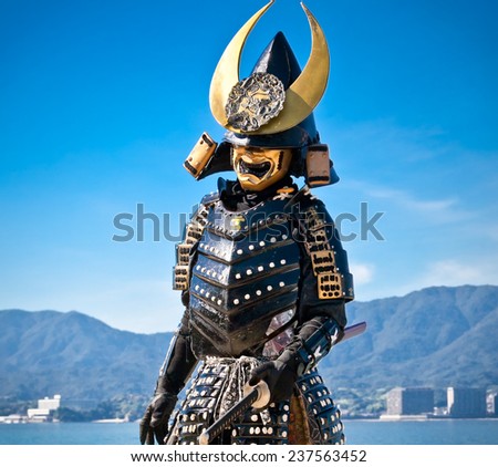 MIYAJIMA, JAPAN - OCT 19: Japanese man in samurai costume on Oct 19, 2014 in Miyajima, Japan. Samurais were the soldiers in the shogun's army and they were feared all over Japan in the Middle Ages.