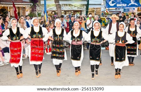 CHANIOTIS , GREECE - MAY 18, 2014 : International children\'s folk-dance festival on May 18. 2014 in Chaniotis, Greece. Chaniotis visit more than 200 000 European tourists every year.