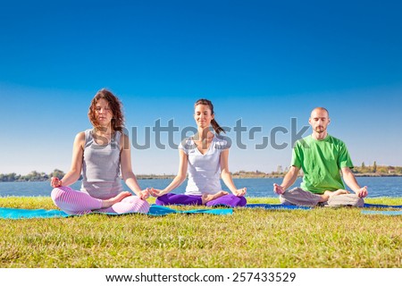 Group of young people have meditation on yoga class. Yoga concept.