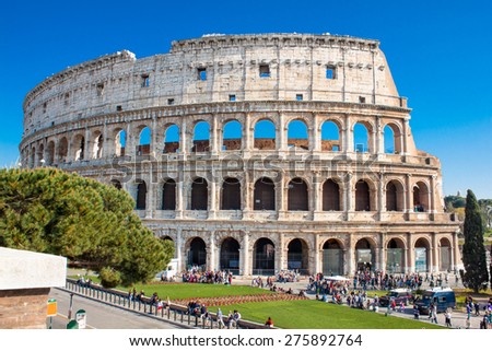 ROME - ITALY, APRIL 13, 2015: Tourists visiting the Colosseum on April 13, 2015. The Colosseum is an iconic symbol of Imperial Rome. It is one of Rome\'s most popular tourist attractions in Rome.