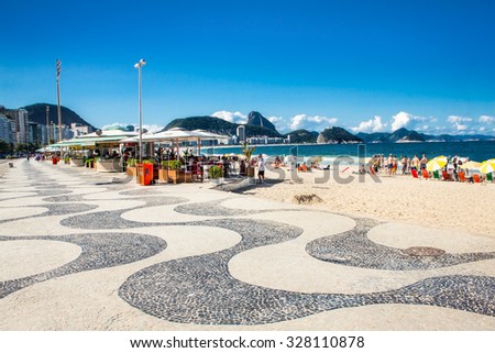RIO DE JANEIRO, BRAZIL - APRIL 24, 2015: Iconic sidewalk tile pattern at Copacabana Beach on April 24, 2015 in Rio de Janeiro. Brazil.