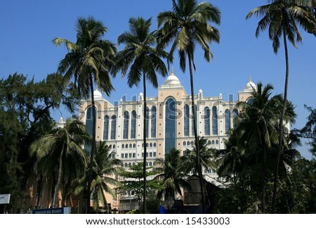 stock-photo-big-building-among-the-palm-trees-on-marine-drive-in-mumbai-15433003.jpg