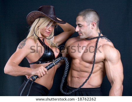 Cowboy girl and boy. Art shot of a pretty model with whip.