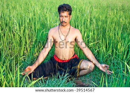 Man have a meditation in rice field, Kalarippayat, indian ancient martial art of Kerala
