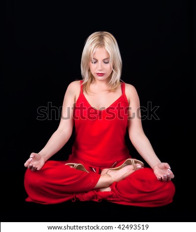 Business woman has meditation at lunch break, isolated on black