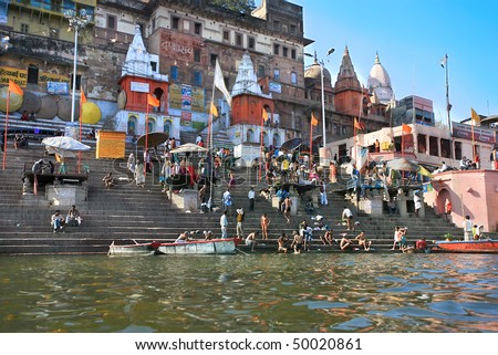 VARANASI, INDIA - 13 FEBRUARY: People worshiping bathing in the sacred River Ganges during a religious ceremony at Uttar Pradesh on February 13, 2008 in Varanasi, India.