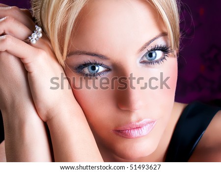 Close up portrait of beautiful  adult woman with blue eyes , studio shot