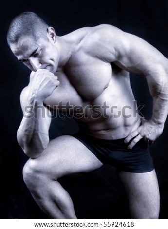 The Perfect muscular man posing , black and white shot