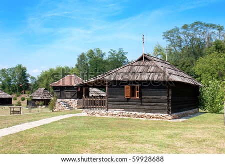 Traditional Timber ethno houses with Wooden Roof and stone base. Velika Plana. Eastern Europe - Serbia