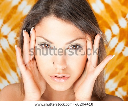 Woman with headache, hand on forehead