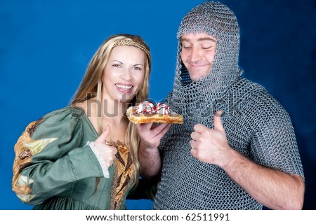 Knight and princes eating waffle with  ice-cream , studio shot