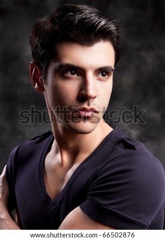 Fashion Shot of a macho Man. A trendy European man dressed in contemporary cloth. He is now a professional model.