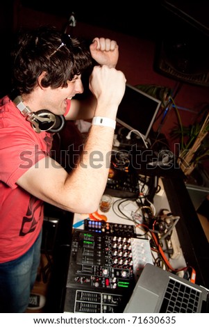 Dj playing disco house progressive electro music at the night club