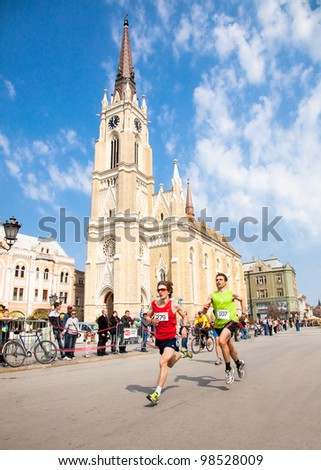 NOVI SAD, SERBIA - MAR 25: Unidentified runners on the street during the Novi Sad spring Marathon on March 25, 2012 in Novi Sad, Serbia