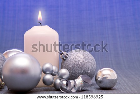 Advent Candle and christmas decoration in blue.