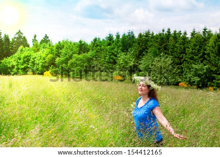 Photo of an attractive woman enjoying the sun on a warm summer day.