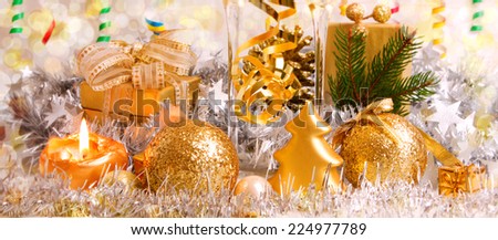 Golden christmas decoration and advent candle.