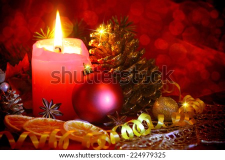 Red christmas decoration and advent candle.
