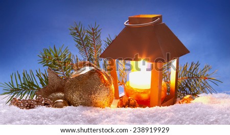 Christmas lantern and golden decoration.