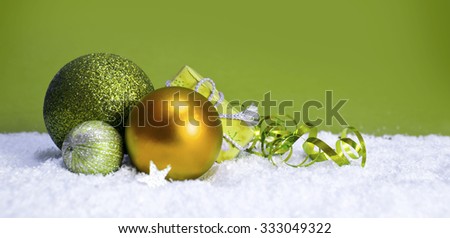 Green christmas balls isolated .Christmas decoration and snow background.