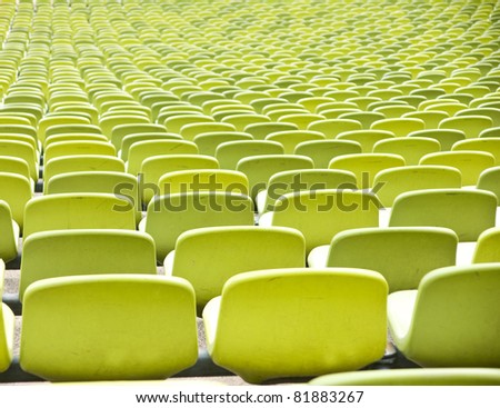 Empty plastic seats at stadium, open door sports arena