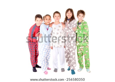 little kids on their pajamas in bed isolated in white
