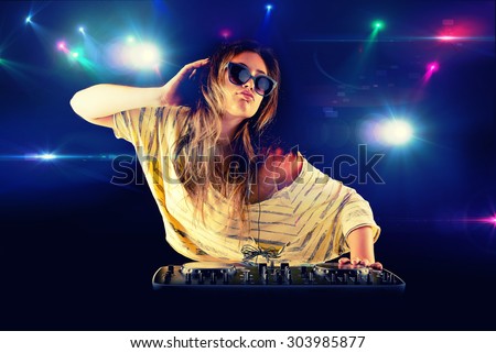 Dj girl dancing with light on background