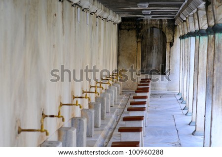 Ablution taps at a mosque in Istanbul where worshippers wash their feet, Istanbul, Turkey