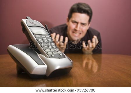 A man pleads for the phone to ring