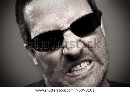 Angry guy in sunglasses