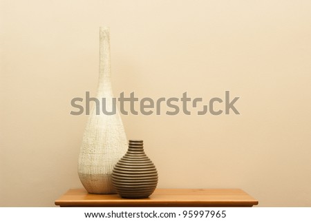 Tall white vase and short striped vase still life - horizontal