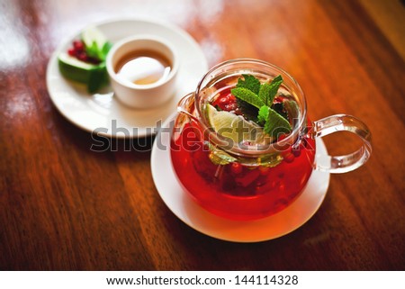 Tea with cowberries in cafe