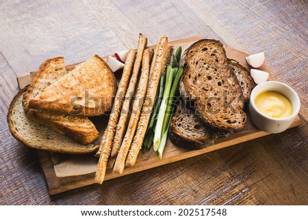 Still-life bread and bread sticks assortment on a plate