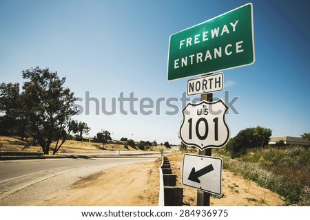 Sunny road and a sign for the 101 San Francisco freeway entrance in California