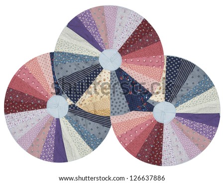 round colorful quilted wheels on a white background