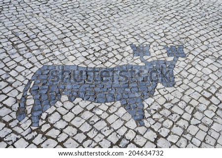 Portuguese Cobblestone Sidewalk with Bull Design