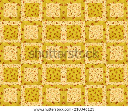 arrangement of quilt squares on batting- cherry design