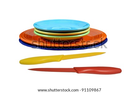 vintage fiesta-ware with yellow and red knifes on a white background