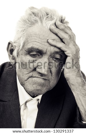 Portrait of a thoughtful old man on white. Black and white