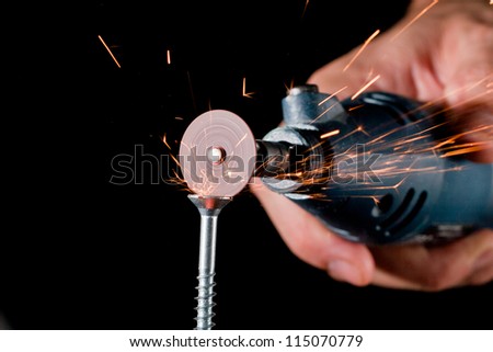 using a rotary tool to cut a new slot in a wood screw