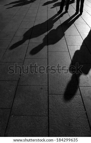 People shadows on street