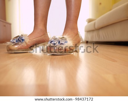 Child on big shoes