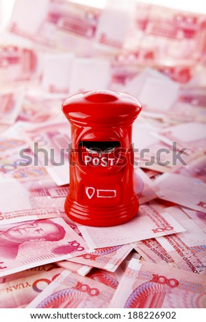 Yuan notes from China\'s currency. Chinese banknotes. Toy money box.Piggy bank.