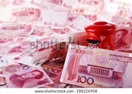 Yuan notes from China's currency. Chinese banknotes. Toy mailbox.Money box.Piggy bank.