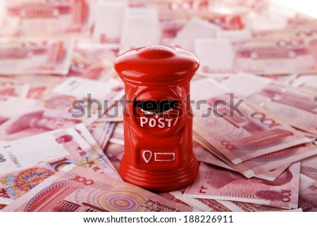 Yuan notes from China's currency. Chinese banknotes. Toy mailbox.Money box.Piggy bank.