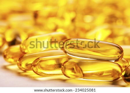 Fish oil capsule isolated on white.