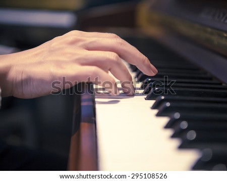 Piano with players hands
