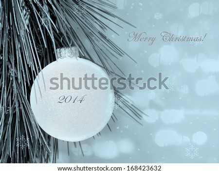 Merry Christmas postcard with simple decoration ball and blurred background